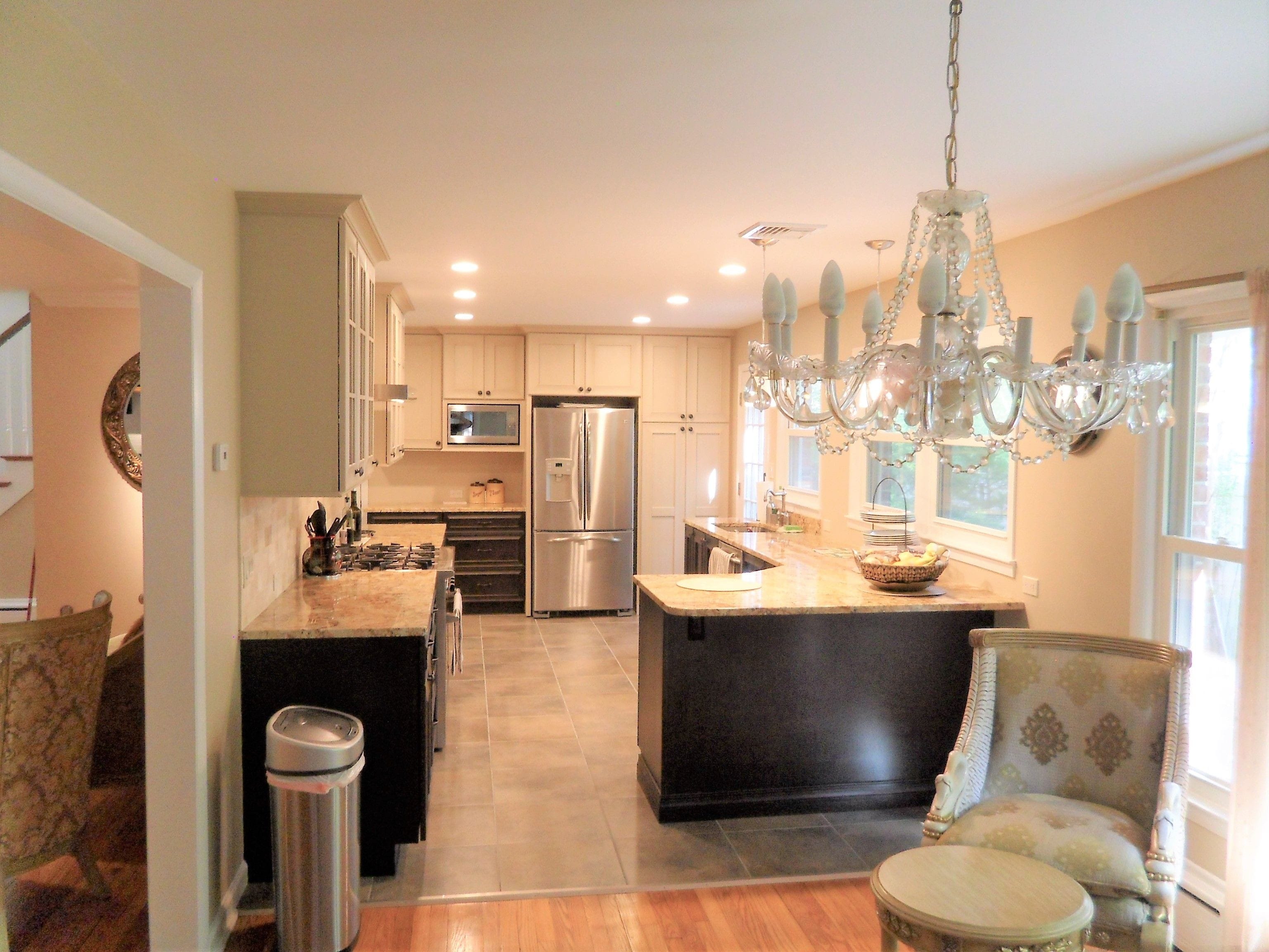 Brighton Cabinetry, Woodridge Door. Masterpiece finish on maple  on the wall and tall cabinets, Peppercorn on Maple on the base cabinets